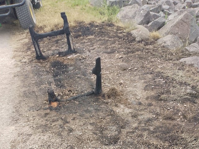 The memorial bench pictured after it was destroyed.