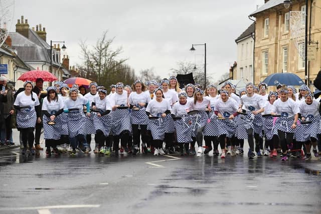 And they're off... Olney's famous pancake race begins