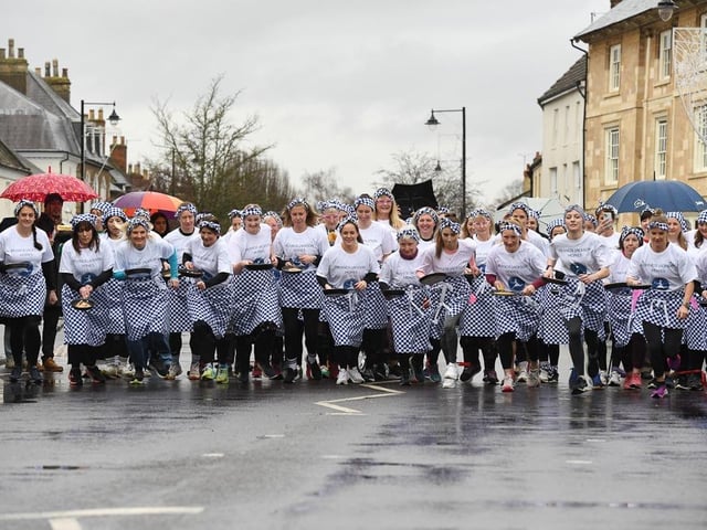 And they're off... Olney's famous pancake race begins