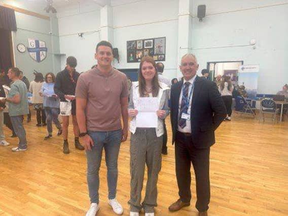 Staff celebrating students’ results. Mr Cope (left), Emily (centre) and Mr Frazer (right).