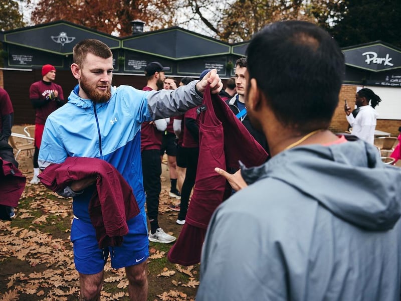 Team Shoe-Box fighter Eithan James helps dish out the Matchroom t-shirts