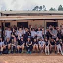 The volunteers who took part in the trip with The Abode Project to Uganda outside The Abode Junior School.