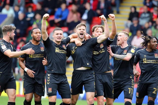 Jon Guthrie and his team-mates celebrate after Cobblers doubled their lead against Leyton Orient. Pictures: Pete Norton.
