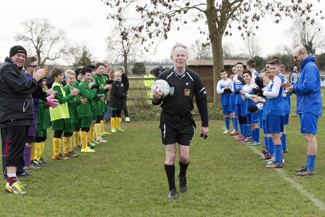 Players form a guard of honour for referee Ron McCahill for his last-ever match, which was Kislingbury v Inspiration FC under 12's in 2016, after 60 years.