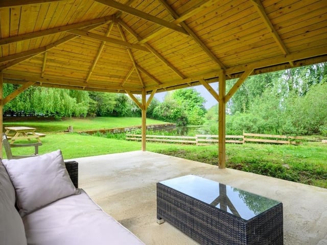 This Victorian home has a tennis court, huge gardens and a private mooring on the River Nene.