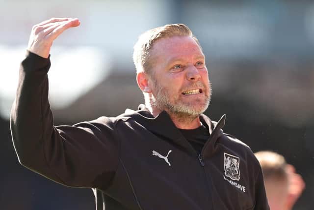 Kevin Nolan celebrates in front of the 1,600 Cobblers fans at full-time
