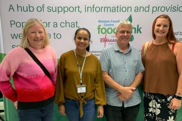 Pictured are two staff members from Baby Basics and two from the food bank - who have worked together since the food bank was first located at Emmanuel Church in 2013.