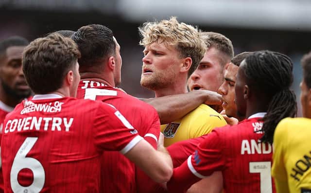 Cameron McGeehan squares up to former Cobbler Lloyd Jones at the end of Friday's game
