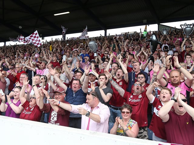 2016: Northampton Town fans welcome there team on the pitch prior to the Sky Bet League Two match between Portsmouth and Northampton Town at Fratton Park on May 7, 2016 in Portsmouth, England. (Photo by Pete Norton/Getty Images)