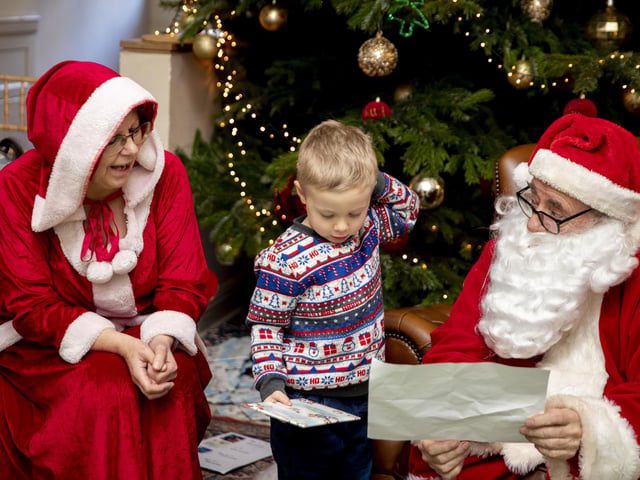Children meet Father Christmas at Delapre Abbey in December 2022.