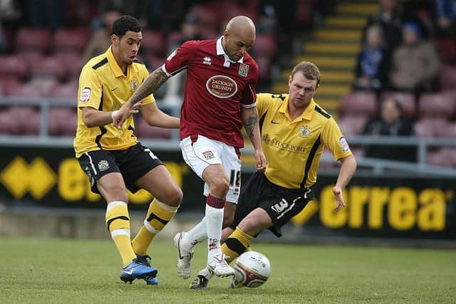 Leon McKenzie battles for the ball the last time that Stockport played at Sixfields, back in December, 2010 (Picture: Pete Norton)