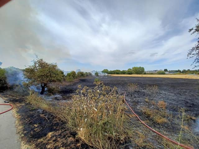 More than 20 firefighters tackled a blaze on scrubland near Briar Hill, Northampton, which investigators believe may have been started by kids playing with fire