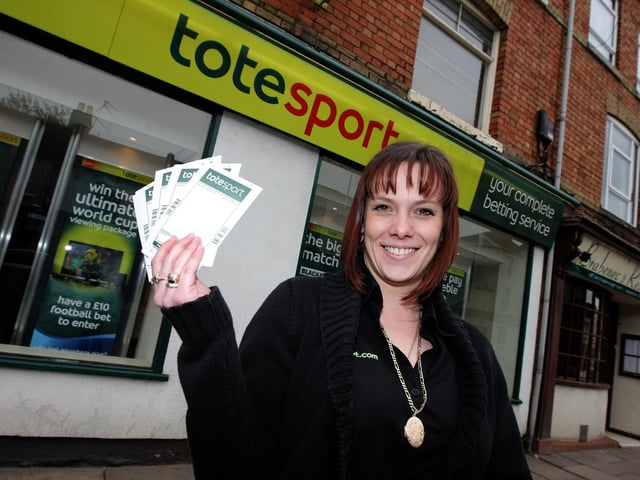 2010 - Totesport, Wellingborough Road, Jacqui Carr with betting slips.