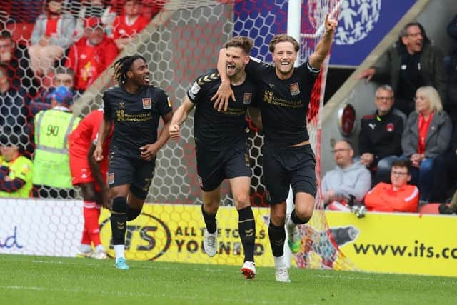 Jon Guthrie pipped his centre-back partner to a place in the League Two team of the season.