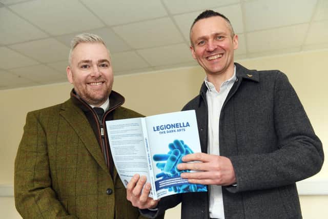 Ian Stone and Neil Munro pictured with their latest book, Legionella: The Dark Arts