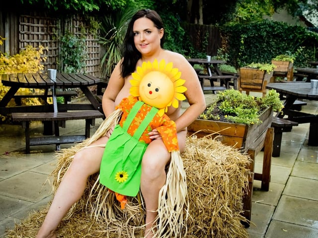 Kerry Prosser, 34, The Royal Oak manager, is featured on the calendar page for July, themed after The Crick Scarecrow Festival.