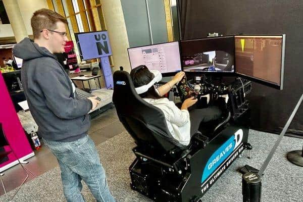 Game programming student Samuel Waite showcases his driving test simulator.