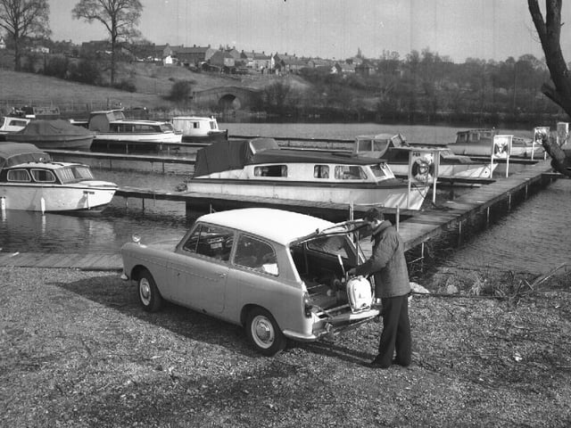 Man with Austin A40 at marina