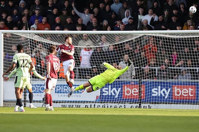 Jordan Thorniley heads away Jordan Clark's goalbound shot.