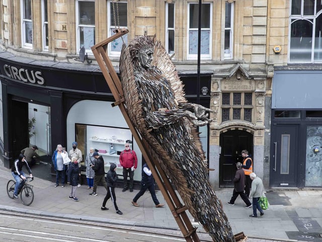 The task of lifting the statue upright took a while but made an enthralling sight for early morning shoppers