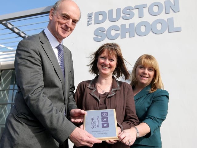 2009: Stuart Almond, operations director of EMQC, Jane Herriman, headteacher of The Duston School and Viv Pallett, administration manager at The Duston School, with their charter mark award.