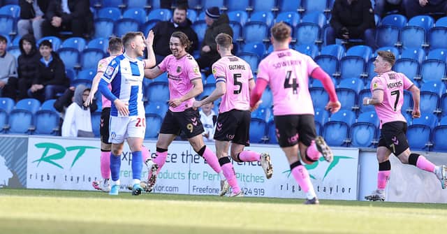 Louis Appéré celebrates his fourth league goal of the season and the winner against Colchester on Saturday.