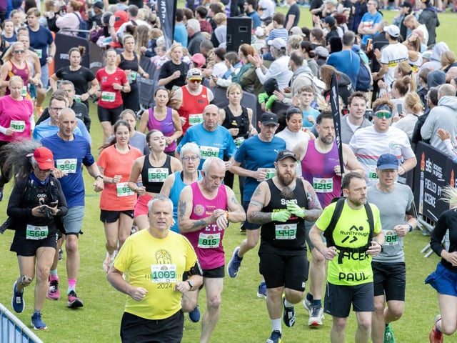 Hundreds of runners braved showers and wind to take on the race on Sunday (May 25), which started and finished at Sixfields stadium.