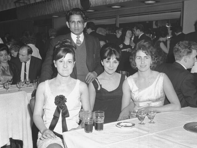 Old glass negs
Looking Back
Three women and man at table at party in mid-60s