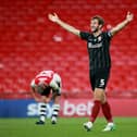 Charlie Goode celebrates after Cobblers win the 2020 League Two play-off final against Exeter City at Wembley. Picture: Pete Norton/Getty