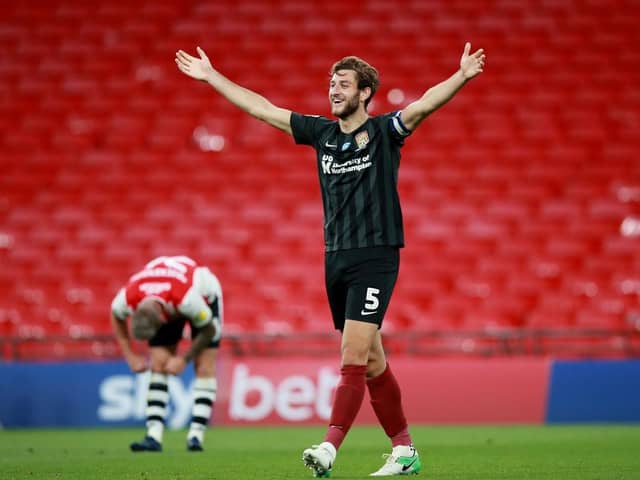 Charlie Goode celebrates after Cobblers win the 2020 League Two play-off final against Exeter City at Wembley. Picture: Pete Norton/Getty