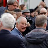 Britain's King Charles III visits a food market on Wittenbergplatz in Berlin, on March 30, 2023, ahead of his coronation in May.