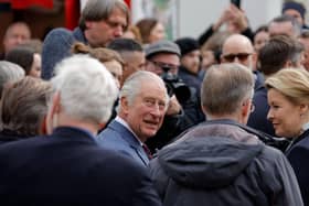 Britain's King Charles III visits a food market on Wittenbergplatz in Berlin, on March 30, 2023, ahead of his coronation in May.