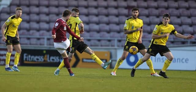 Marc Leonard fires home from long-range to give Cobblers the lead against Burton.