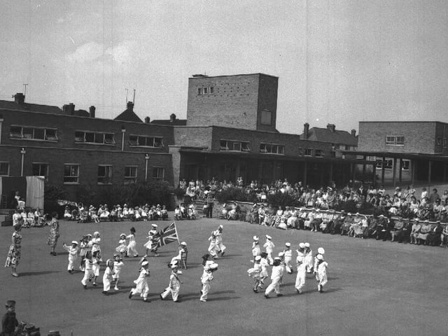May Day celebrations at Gladstone School, Northampton, children in sailor suits dancing