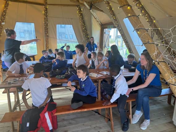 Inside the 'teepee' for extra lessons. Associate Professor Emma Whewell leads the class.