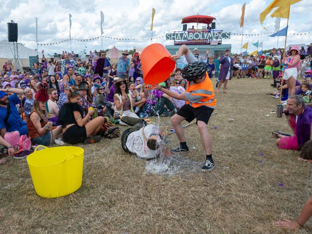 A blindfolded member of one of the teams competing in the Shambolympics misses the bucket at Shambala on Sunday, August 30, 2026. Photo by David Jackson.