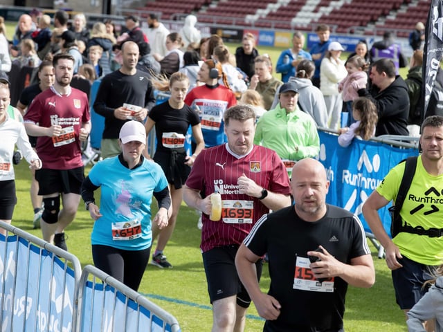 Hundreds of runners braved showers and wind to take on the race on Sunday (May 25), which started and finished at Sixfields stadium.