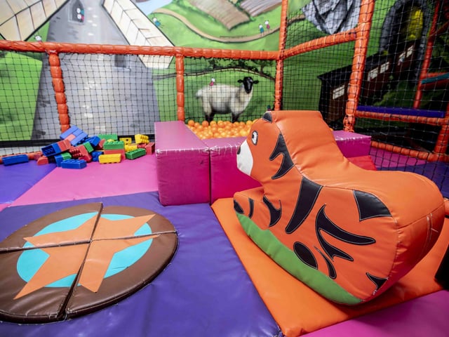 There is a new sensory room, car wash role play zone, two large ball pits with ball showers, and a sports court with astroturf on the top level.
