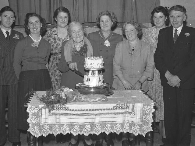 Family gathering with cake
