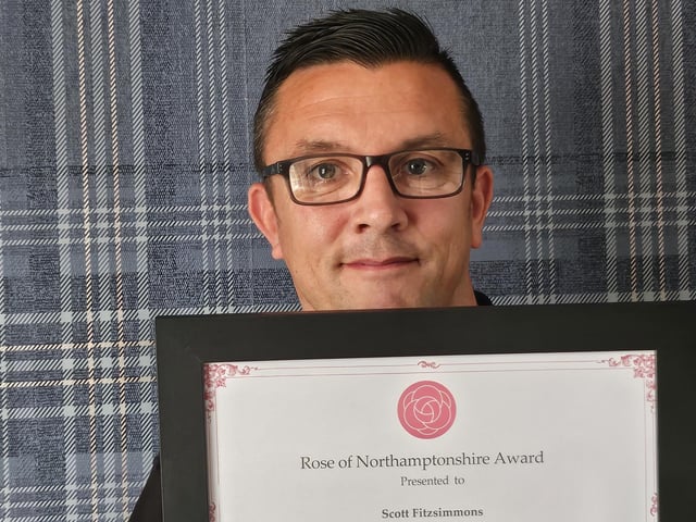 Rachel Mallows MBE DL, Chair of Northamptonshire Community Foundation, presenting Scott Fitzsimmons, Trustee at Glamis Hall for All and volunteer at Northants Fire & Rescue, Off the Streets, Crimestoppers, Wellingborough Ukrainian Refugee Support Group, with a Rose of Northamptonshire Award. Scott Fitzsimmons volunteers for several local organisations including Northants Fire & Rescue, Off the Streets, Crimestoppers, Wellingborough Ukrainian Refugee Support Group, and is a newly appointed trustee for Glamis Hall for All