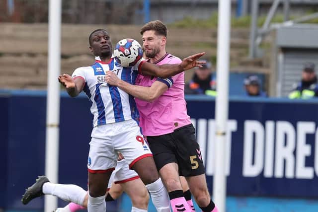 Cobblers skipper Jon Guthrie had his problems against the excellent Josh Umerah during Saturday's game