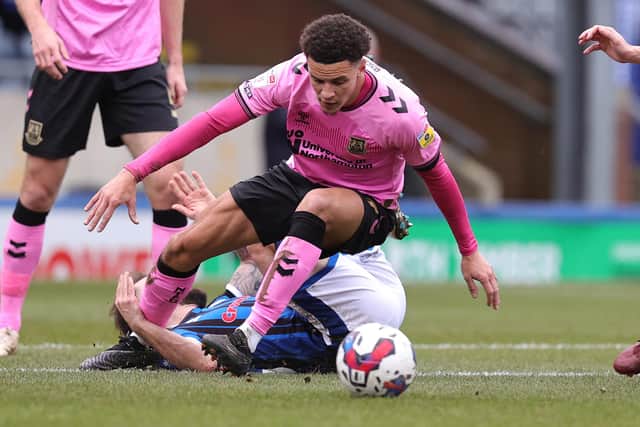 Shaun McWilliams tangles with Danny Lloyd of Rochdale during the 1-1 Sky Bet League Two draw between the sides on Saturday (Picture: Pete Norton)