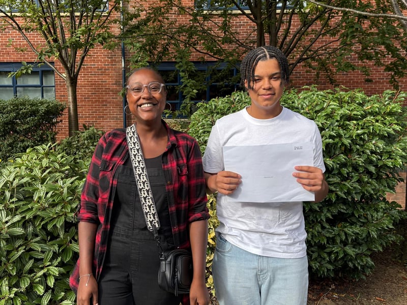Joel with his 'very proud' mother, who teaches at Malcolm Arnold Academy