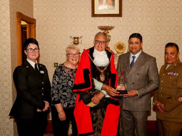 Naz Islam receiving his award from the Mayor of Northampton, Cllr Dennis Meredith
