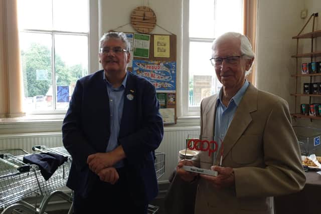 Nick Matthews chair of Co-opsUk (left) presenting Co-operative lifetime to Roger Sawtell in 2019