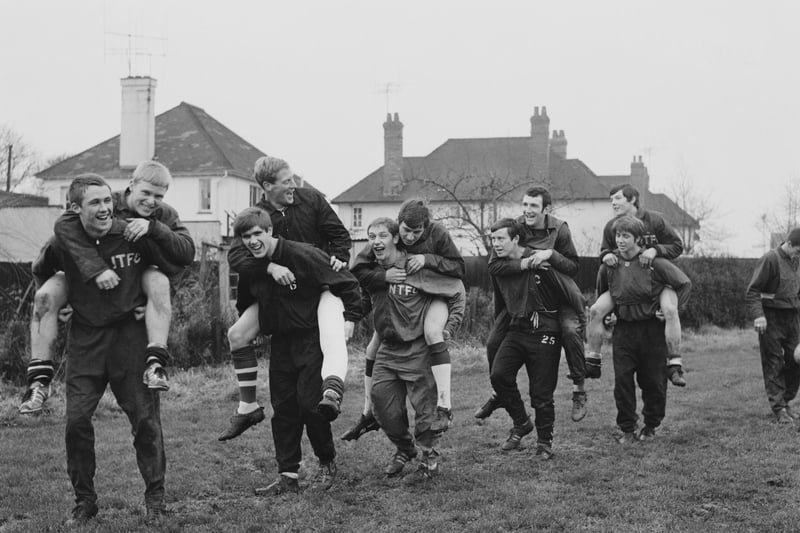 Northampton Town FC players carry each others piggyback during a training session on 23rd December 1968.