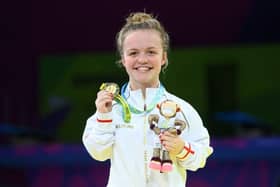 A beaming Maisie Summers-Newton shows off her Commonwealth Games gold medal