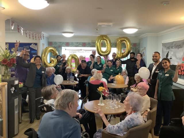 Juniper House Staff and residents celebrating rating