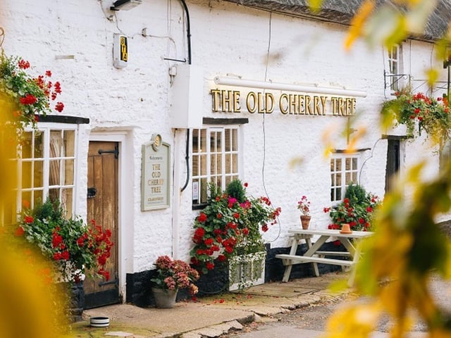 Ingoing Cost: £26,000, Annual Rent: £28,000. A sale advert reads: "The Old Cherry Tree is a well-maintained 16th-century thatched property known for its exceptional dining experience. Popular with locals and visitors from Northampton, it offers a range of cask ales and premium wines. The pub features a traditional bar, private Parquet room (12 covers), and a separate dining/function room (32 covers). With a developed food offer, it also boasts a well-equipped kitchen, ample storage, and a charming garden for summer months, as well as a cosy indoor fireplace for winter."