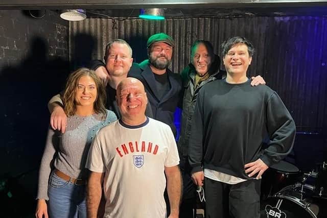 Maddox Jones with others involved in the We’re All Here Together (Go England!) video and song.